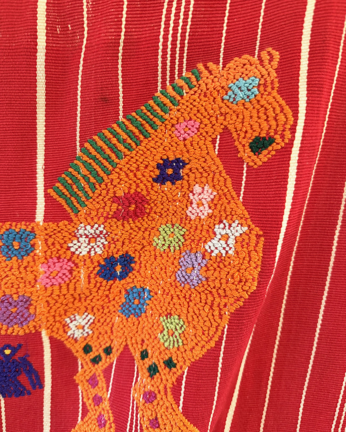 Vintage Guatemalan handwoven cotton textile with horse and frog motifs on red
